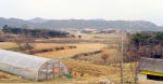 지네 형상인 수암산 아래 농협중앙회 종묘장 비닐하우스 자리가 적지이다.