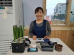 신상희 대표가 가게에서 환하게 웃고 있다.